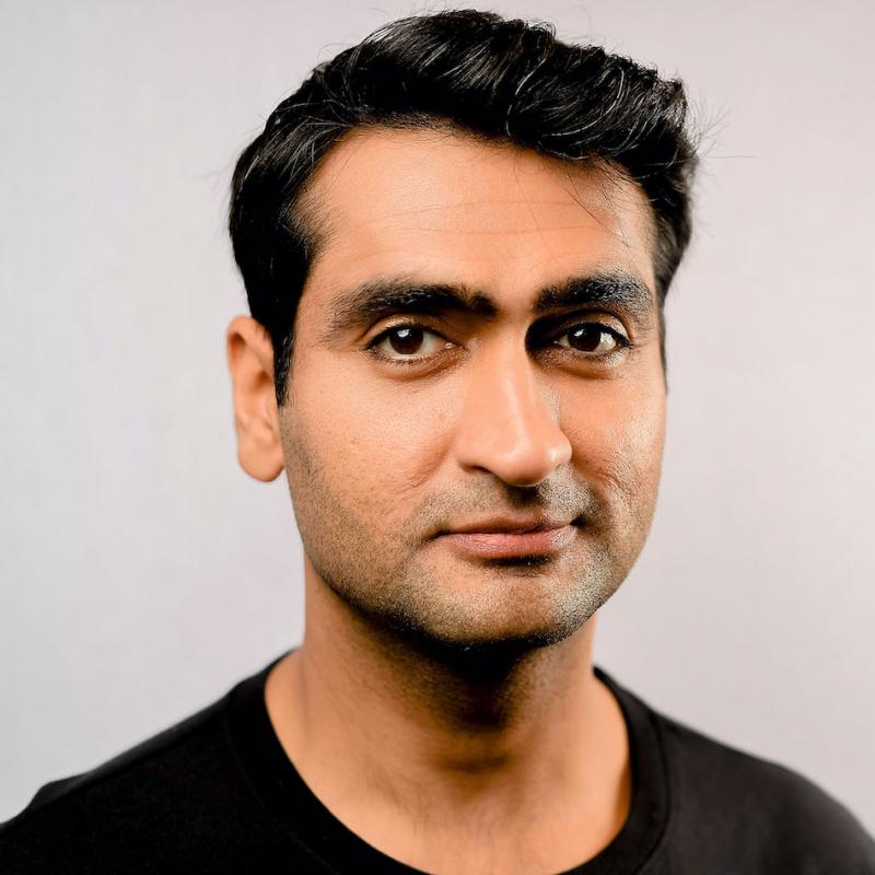 Kumail Nanjiani looks at the camera