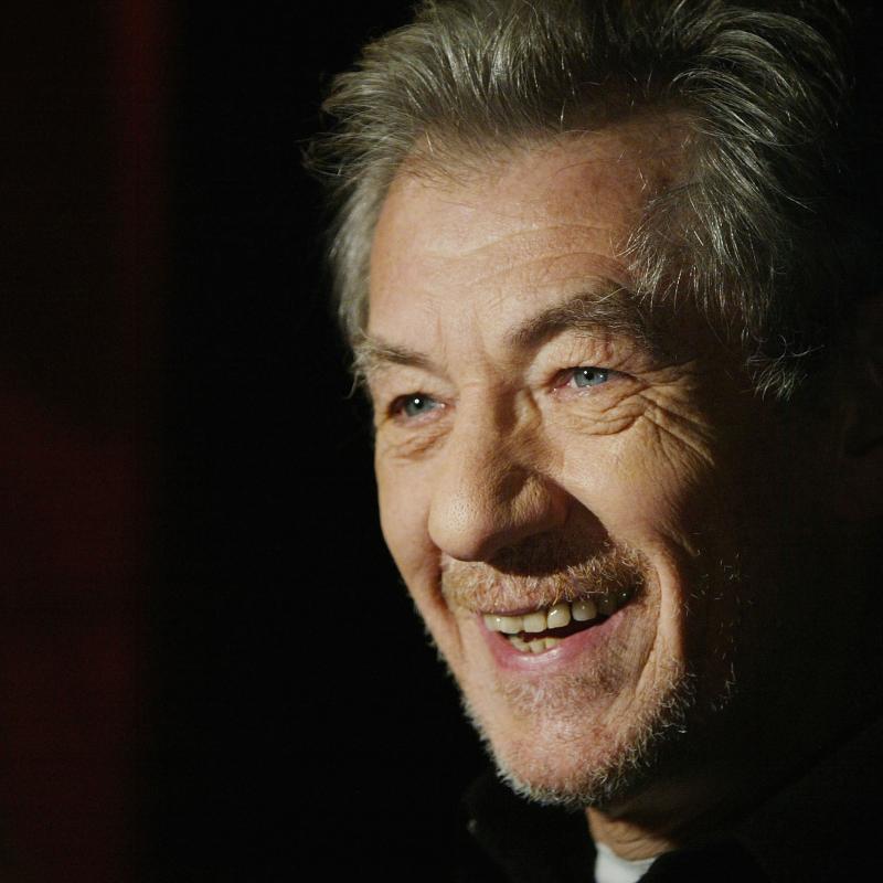 Actor Ian McKellen smiles in a portrait